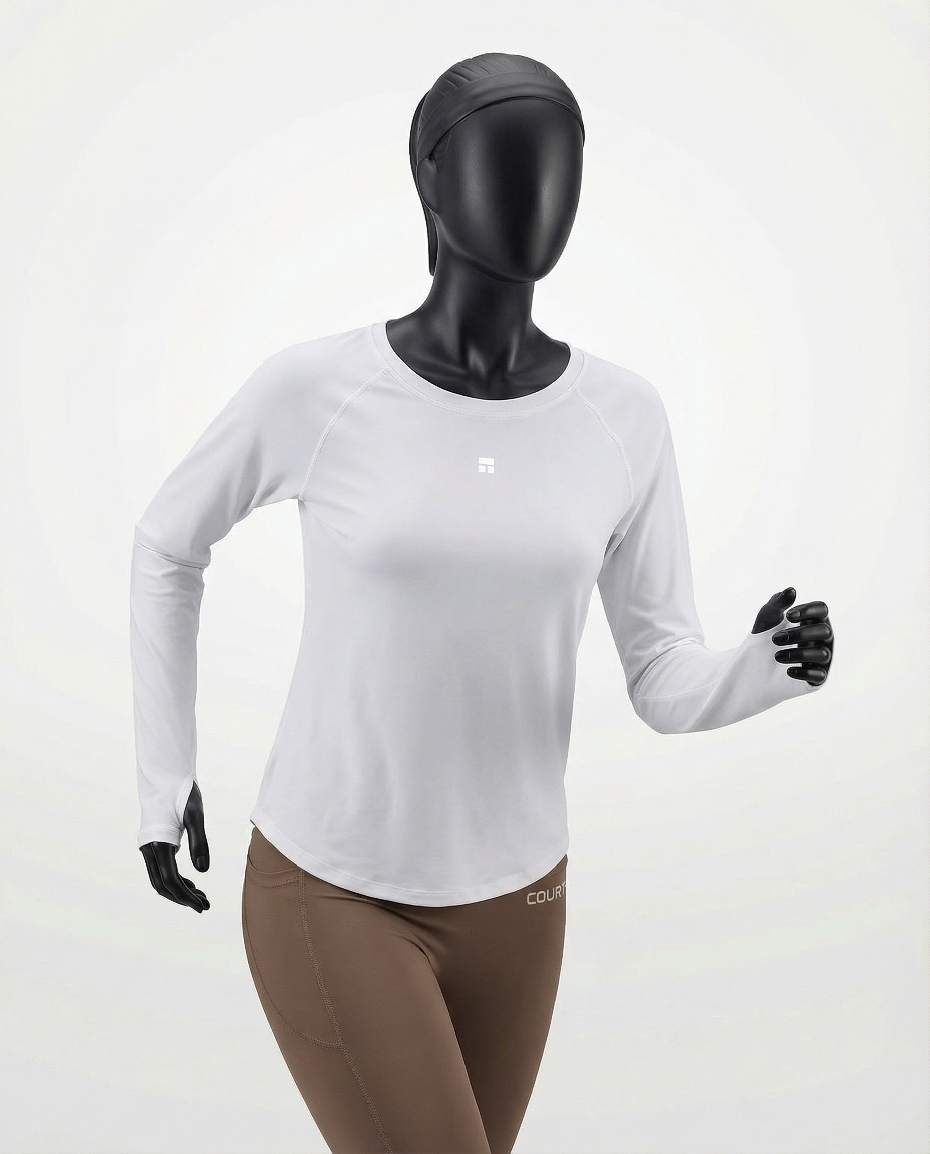 Mannequin wearing a white long-sleeve top with a cutout design on a white background