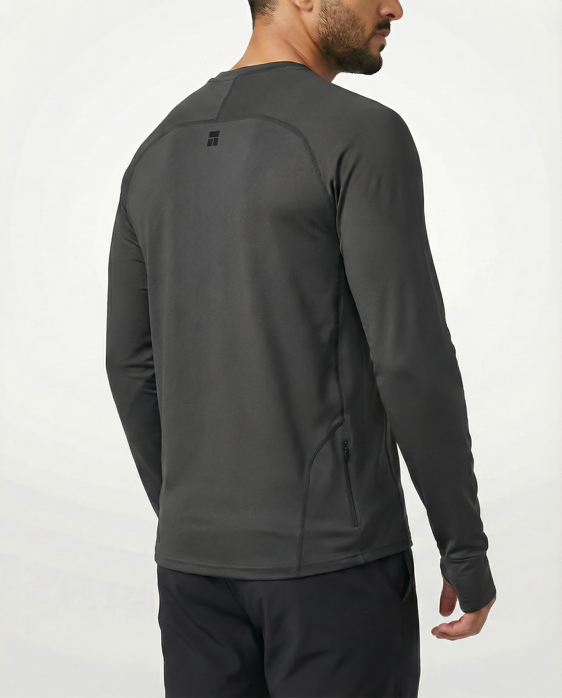 Man wearing a gray long-sleeve shirt against a white background
Courts Sport