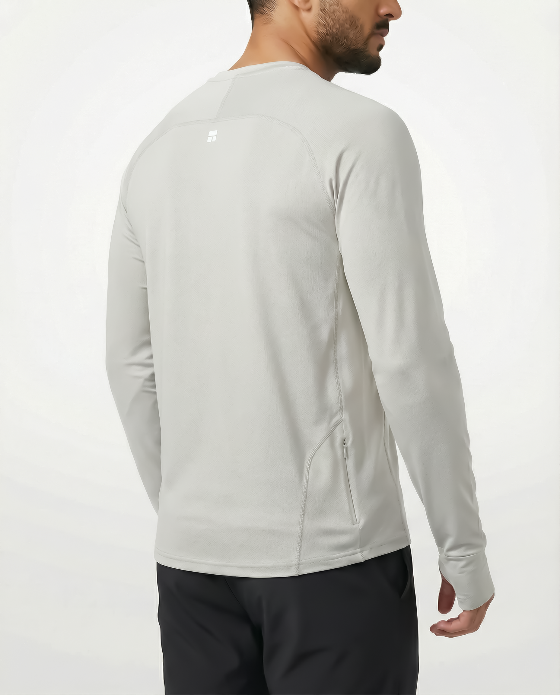 Man wearing a gray ivory long-sleeve shirt against a white background
Courts Sport