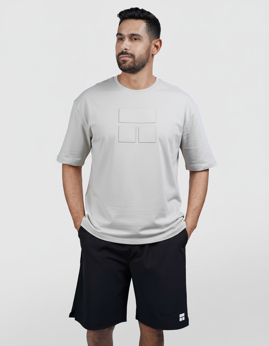 Man wearing a gray t-shirt and black shorts on a white background
#color_light-grey