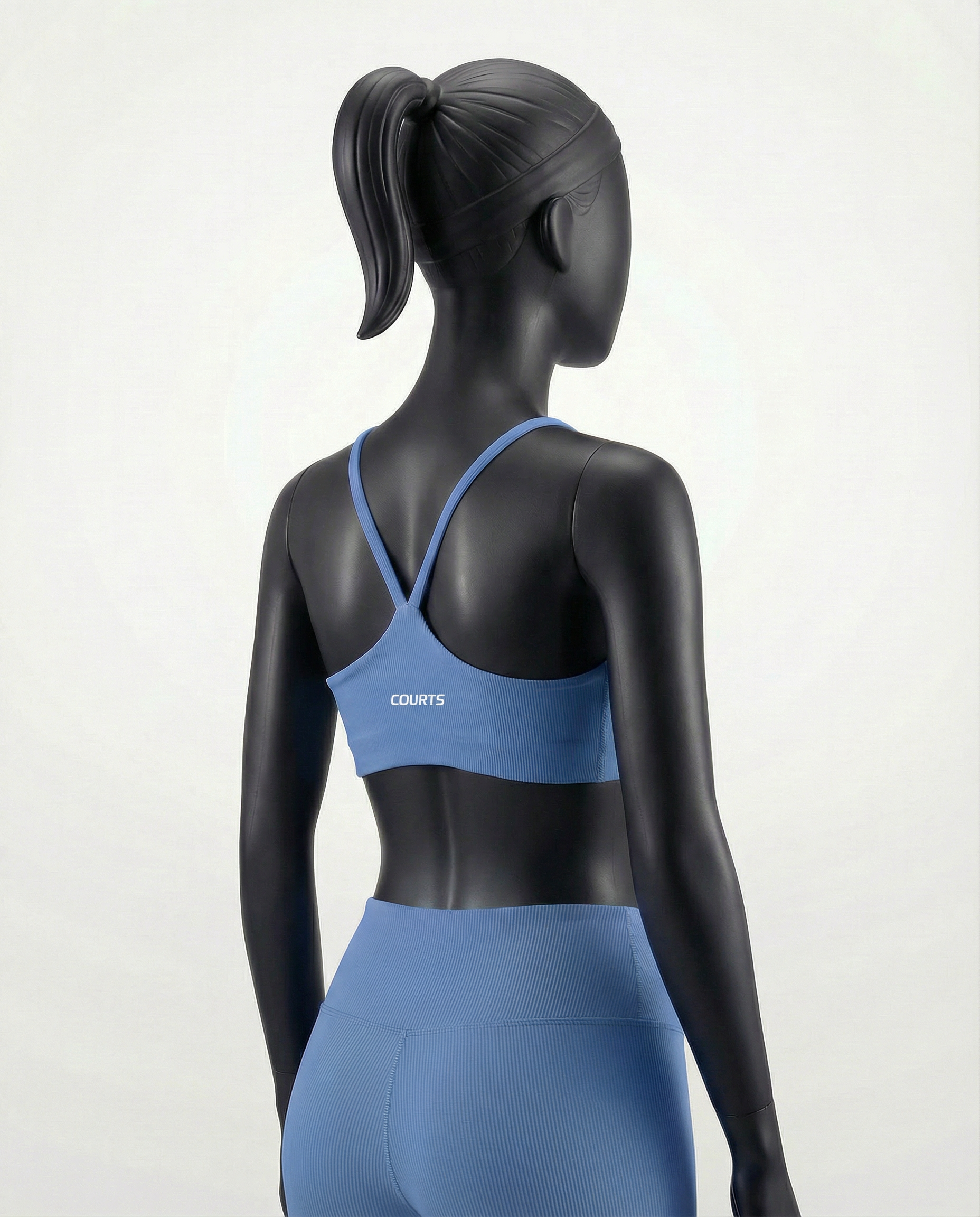 Mannequin wearing a blue sports bra and leggings on a white background
#color_light-blue
