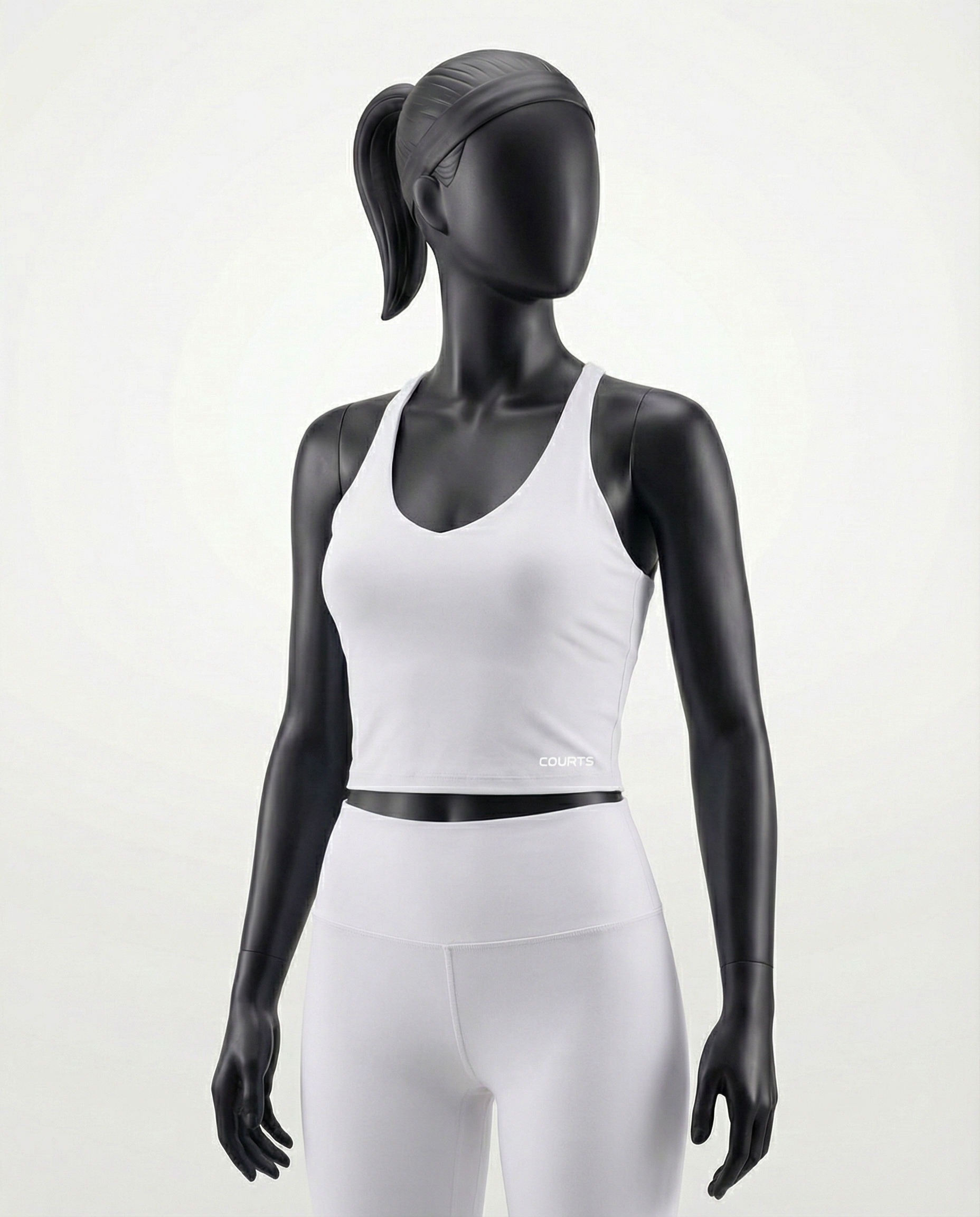 Courts white athletic crop top and leggings on a mannequin against a white background
#color_white