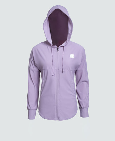 Woman wearing a purple hoodie with a brand logo on a white background
