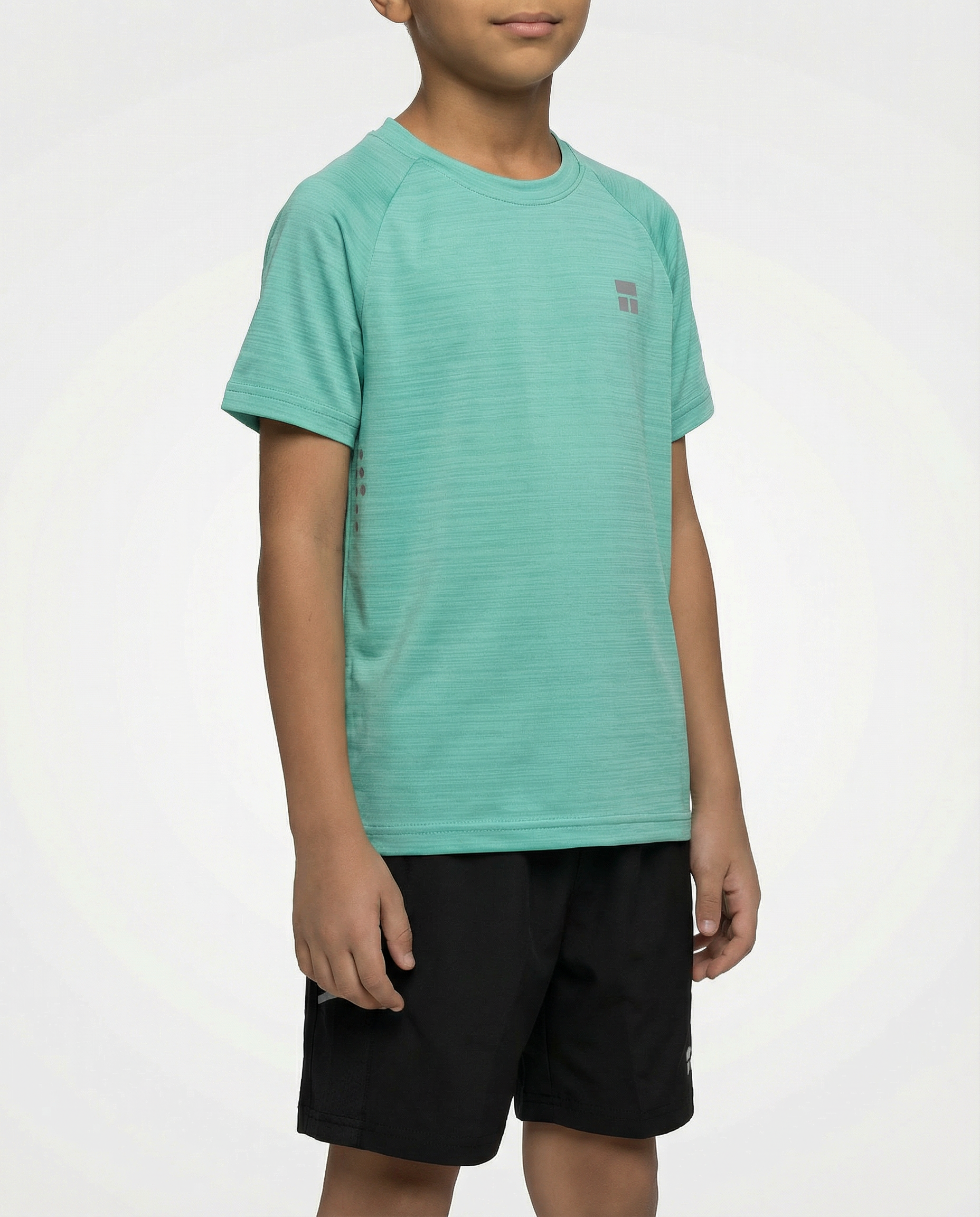 Child wearing a Courts green t-shirt and black shorts on a white background
#color_mint-green