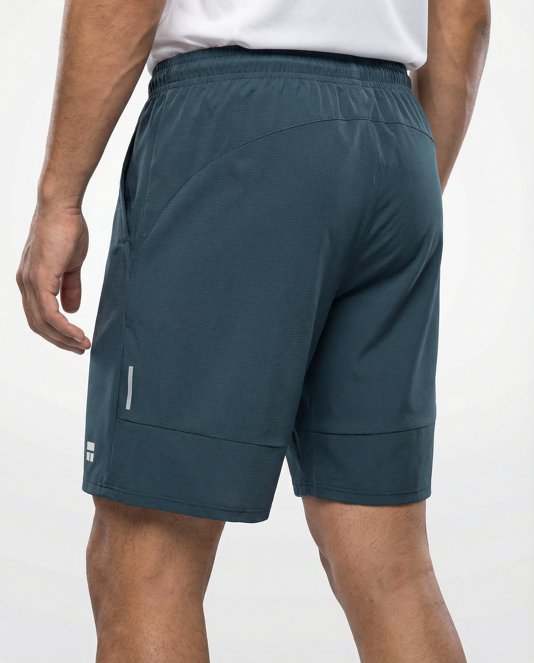 Person wearing haze blue athletic shorts with a visible Courts brand logo on a white background
#color_haze-blue