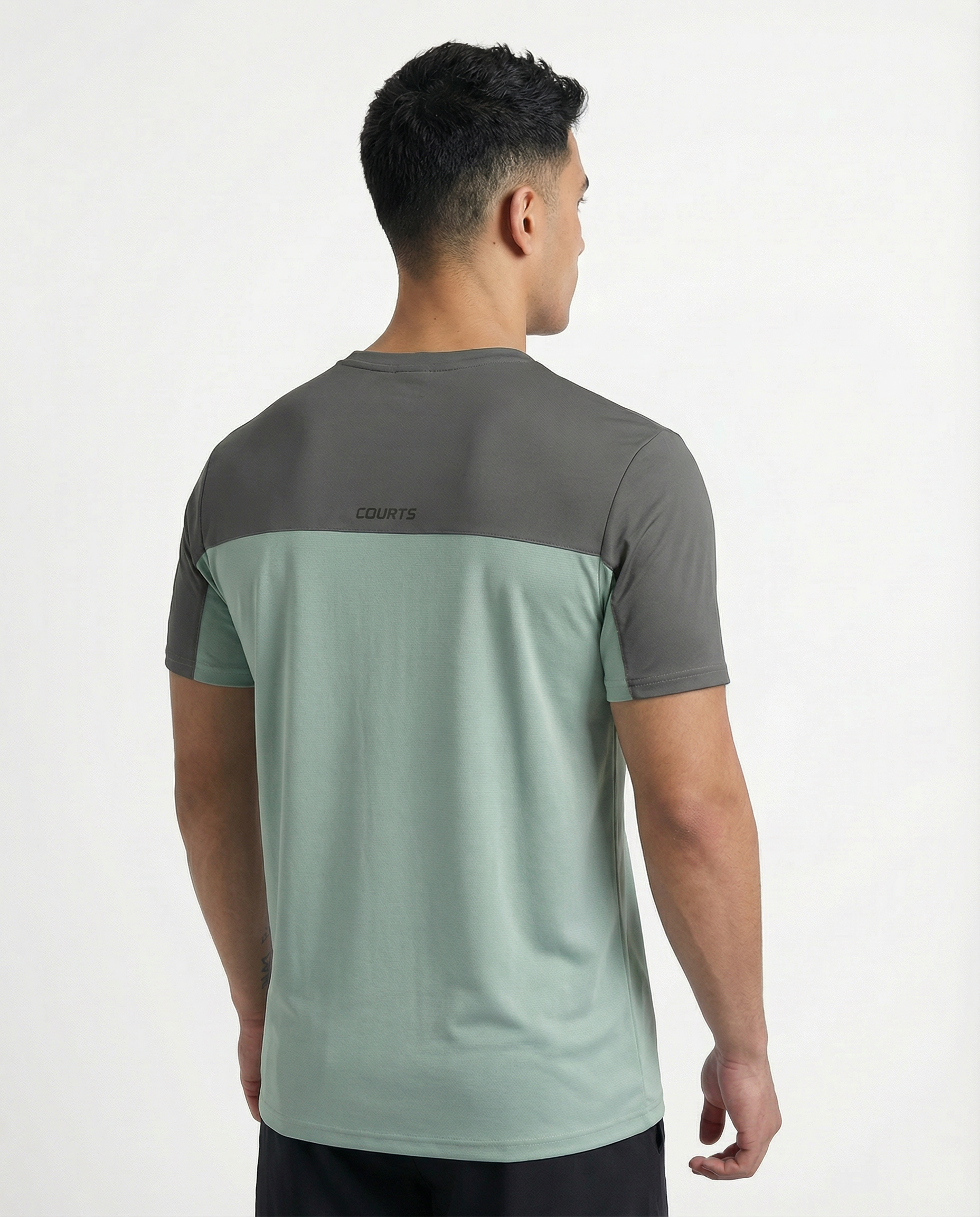 Man wearing a green athletic shirt with a logo on a white background
Courts Sport
#color_frost-green