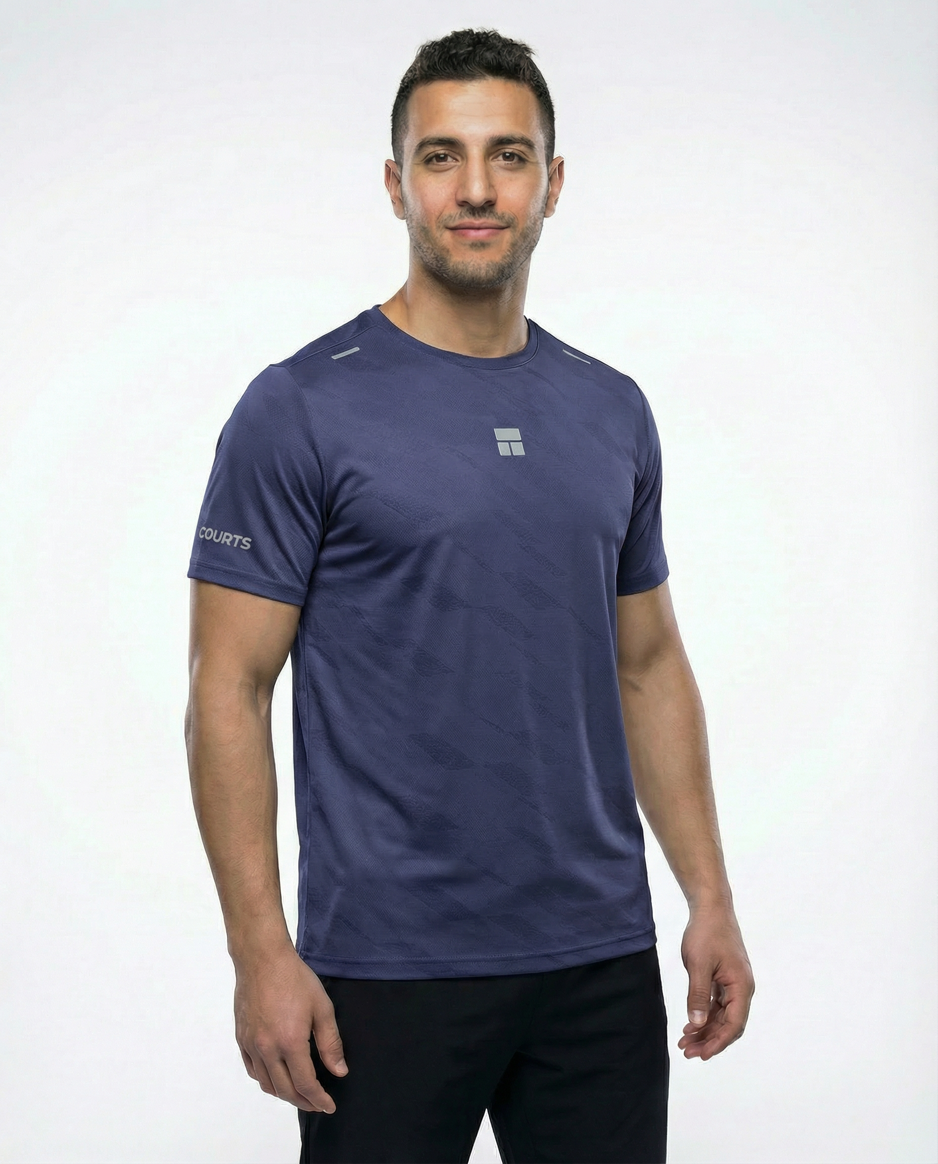 Man wearing a blue courts athletic shirt with a logo on a white background
#color_dark-blue