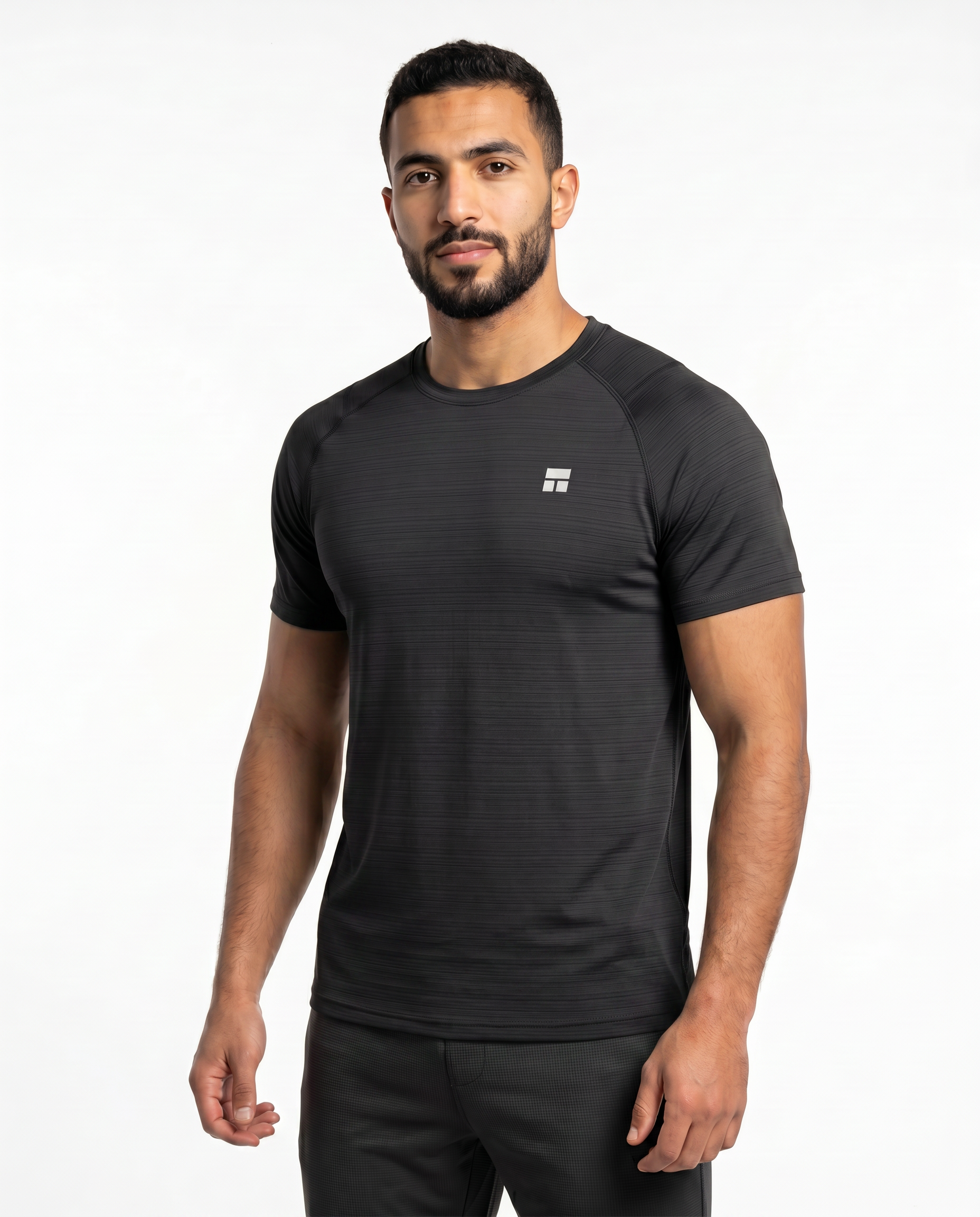 Man wearing a black athletic outfit with a logo on a white background
#color_black