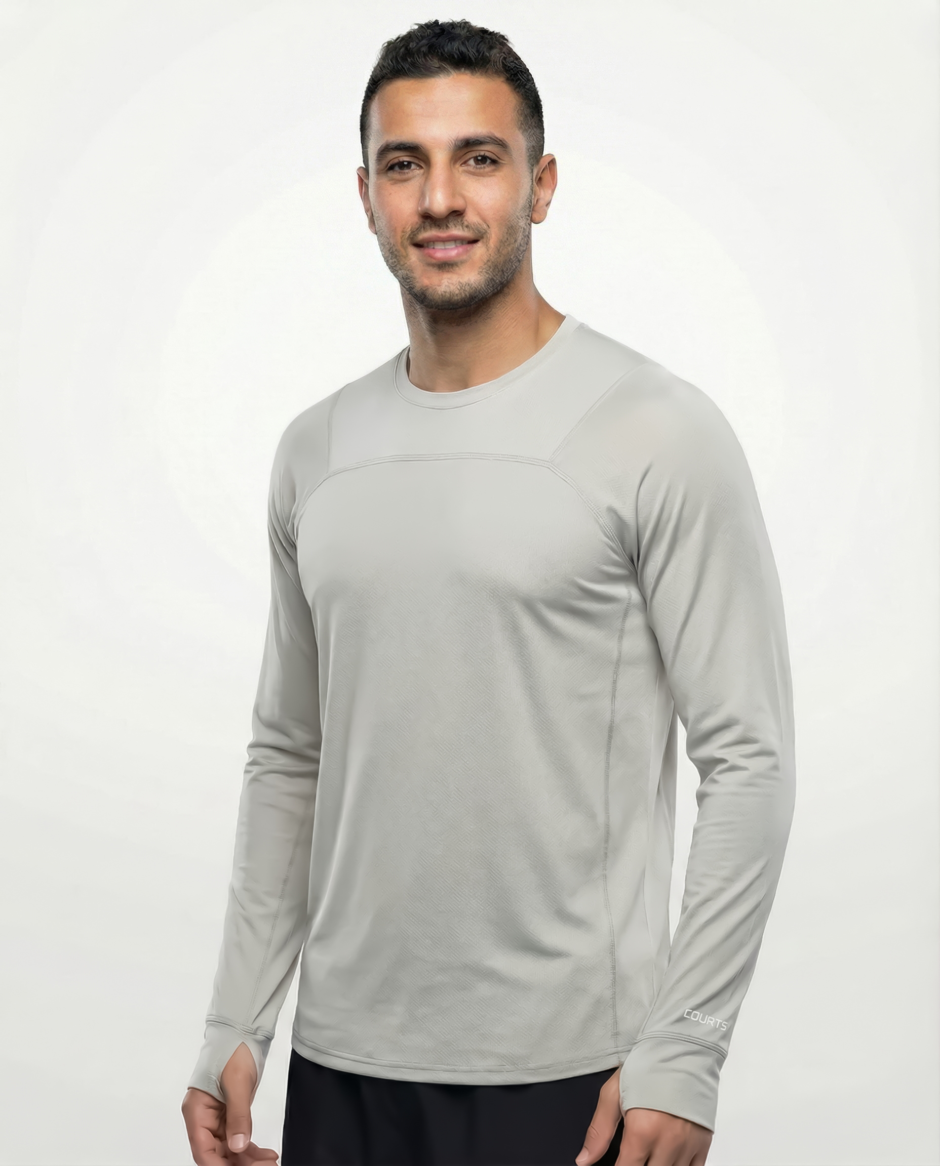 Man wearing a gray ivory long-sleeve shirt against a white background
Courts Sport
#color_ivory